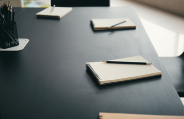 Table with stationery prepared for business meeting in conference hall