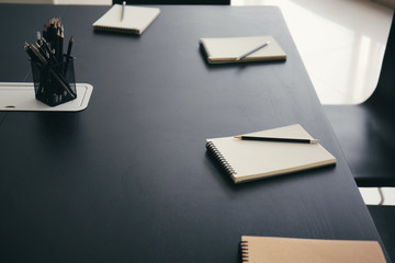 Table with stationery prepared for business meeting in conference hall
