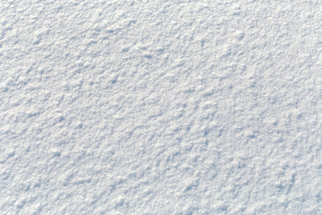 Winter, the surface of fresh fluffy snow, close-up, glare, snowflakes