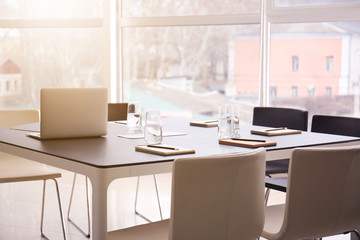 Table prepared for business meeting in conference hall