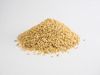 Mountain of sesame seeds on white background