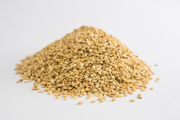 Mountain of sesame seeds on white background