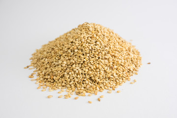 Mountain of sesame seeds on white background
