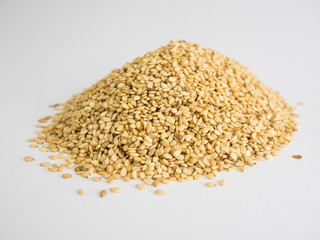 Mountain of sesame seeds on white background