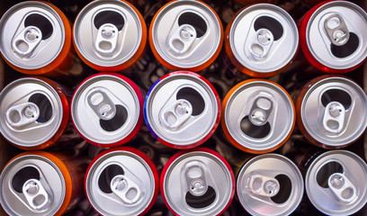 Empty aluminium drink cans recycling background concept, top view closeup