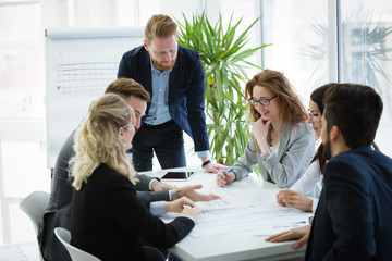 Business people working together on project and brainstorming in office