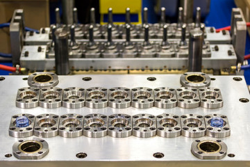 Obraz premium Close up plastic mold bottle blowing for mass production (manufacturing process for industrial work)