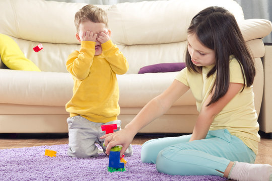 The Sister Of The Offended Brother. Senior And The Younger Child. Children's Quarrels. Brother And Sister Playing Together. The Conflict Between A Boy And A Girl. The Kids Are Fighting