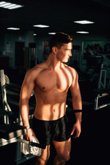 Fototapeta na wymiar muscle guy in a gym