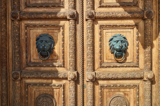 Old carved wooden doors with  lions
