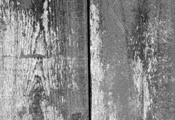 Old grungy wooden planks background in black and white.
