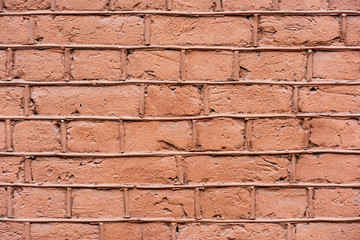Uneven brick wall in scratches