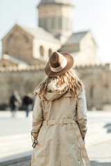 Obraz premium Girl travel blogger outdoors. The ancient capital and the Jvari monastery, Georgia.