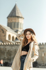 Fototapeta premium Girl travel blogger outdoors. The ancient capital and the Jvari monastery, Georgia.