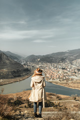 Girl travel blogger outdoors. The ancient capital and the Jvari monastery, Georgia.