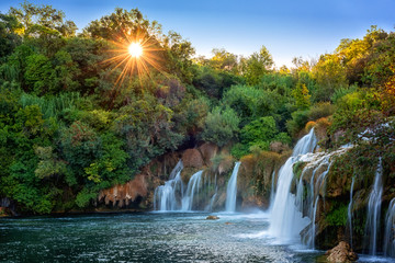 Amazing nature landscape, beautiful waterfall at sunrise, famous Skradinski buk, one of the most beautiful waterfalls in Europe and the biggest in Croatia, outdoor travel background