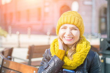 portrait of a beautiful woman smiling and looking at the camera fron city building