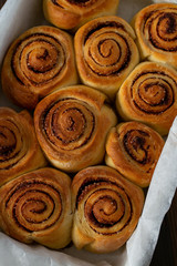 cinnamon rolls on wooden surface