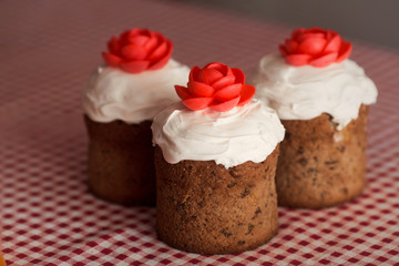 Easter cake with decorative sweet red flowers