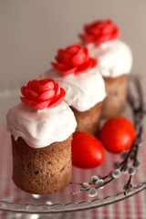 Easter cake with decorative sweet red flowers