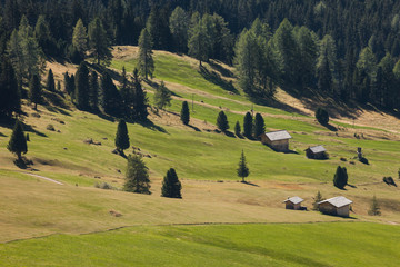 old hayloft in a pasture in Val di Funes at fall