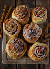 cinnamon rolls on wooden surface