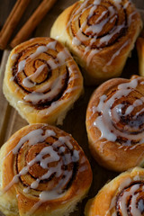 cinnamon rolls on wooden surface