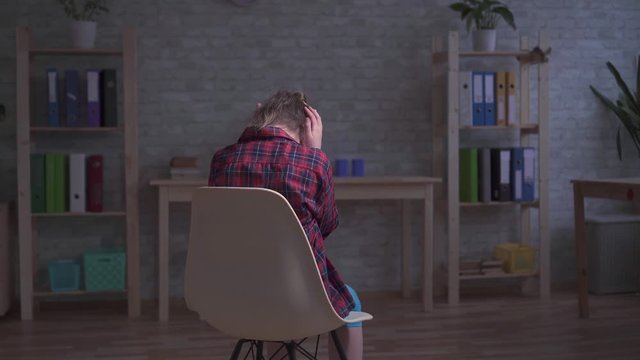 lonely, frustrated and sad a disabled child in the room
