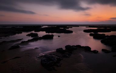 Fototapeta na wymiar sunset over the sea taken with long exposure