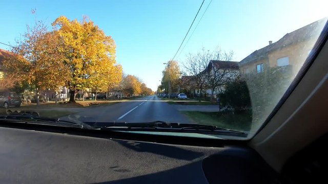 704 Short Car Drive On A Sunny Day Through Little Town