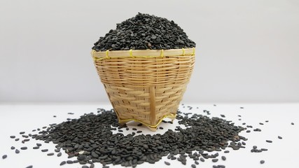 Poppy seeds in a basket with a white background. Poppy seeds that are beneficial to the body