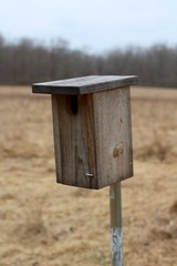 A close view of the old wood birdhouse.