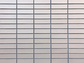 Fototapeta premium Light brown ceramic tile wall