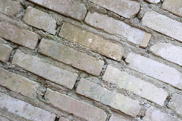 Old brickwork. Brick wall. White silicate brick. Crumbling brick from time to time.