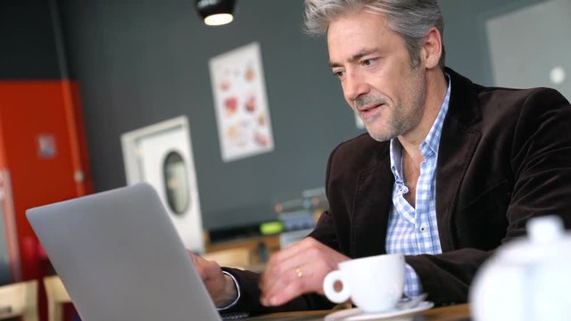 Mature sales director working in modern office space
