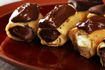 Traditional French dessert. Eclair with chocolate icing. Pastery concept with chocolate eclair