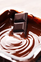 Melting chocolate, melted delicious chocolate for handmade praline icing confectionery