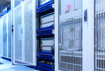 Telecommunication equipment with many cables, switches and air conditioners in a modern...