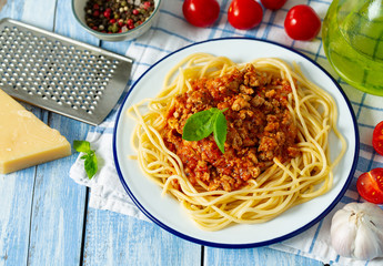 spaghetti bolognese on wooden surface