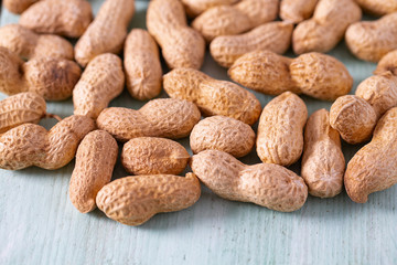 peanuts on wooden surface