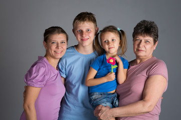 Elderly woman with older daughter and grandchildren