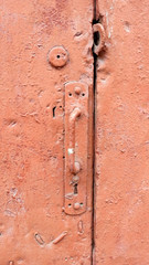 Old door handle red texture.