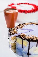 Red velvet cake and purple nut cake on a table with a cup.  beauty cake cut. top view. flat lay. close up 