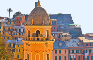 Vernazza village with typical colorful multicolored buildings houses, Castello Doria castle on rock, Ligurian Sea in background, National park Cinque Terre, La Spezia, Liguria, Italy