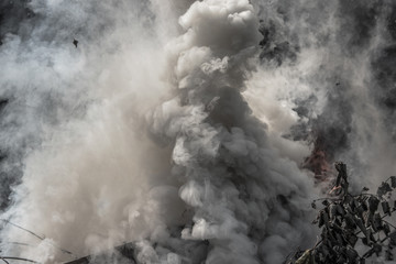 thick smoke from the fire rises