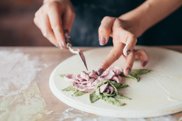 Clay art. Ceramic craft. Artist studio workplace. Woman with modeling tools creating flower artwork.