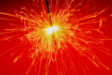 sparkler on red background