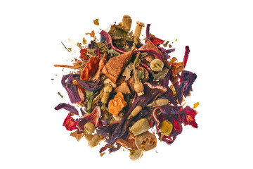 Obraz premium Tea made from wild raspberries and mint with calendula petals, lemon balm, camomile flowers, leaves, currants, apples and hibiscus