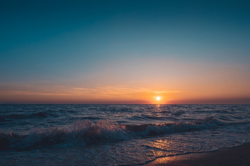Fototapeta na wymiar Sunset sky background on the beach summer concept background.