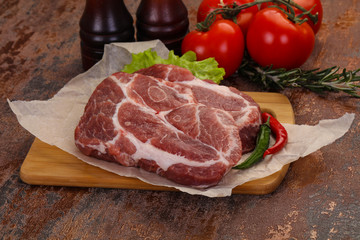 Raw pork neck steak